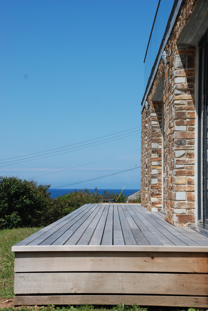 Inspiration for a medium sized nautical back ground level terrace in Cornwall with no cover.