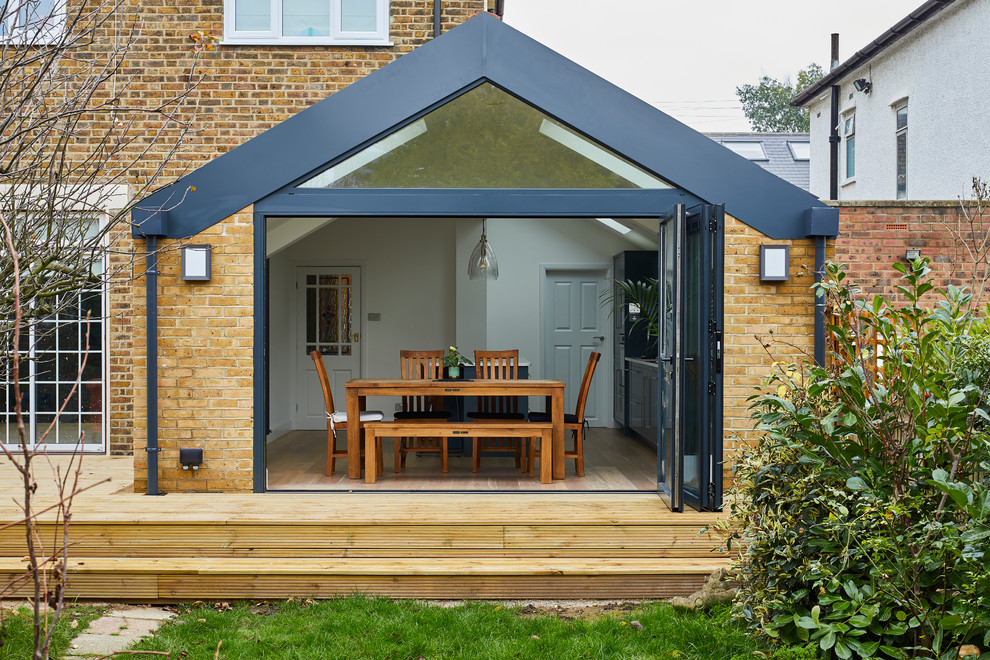 This is an example of a medium sized contemporary back terrace in London with no cover.
