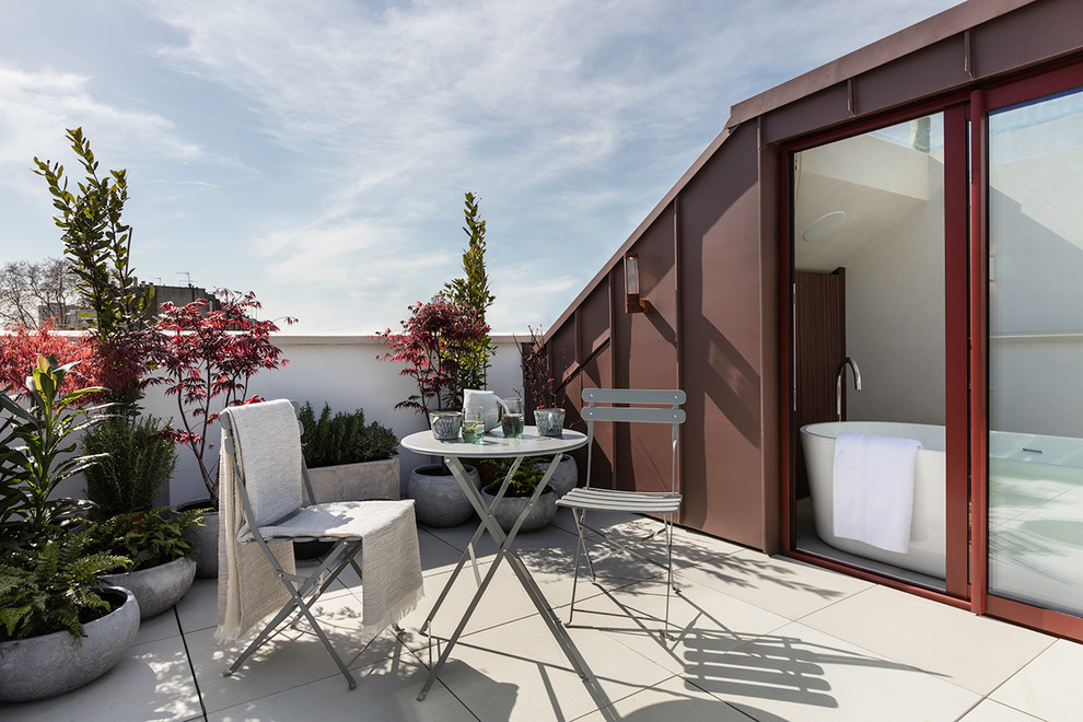 Inspiration for a large contemporary roof rooftop terrace in London with no cover.