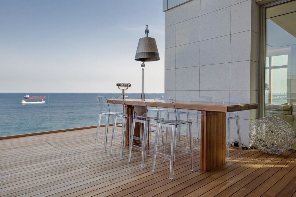 Example of a large trendy rooftop rooftop deck design in Other with no cover