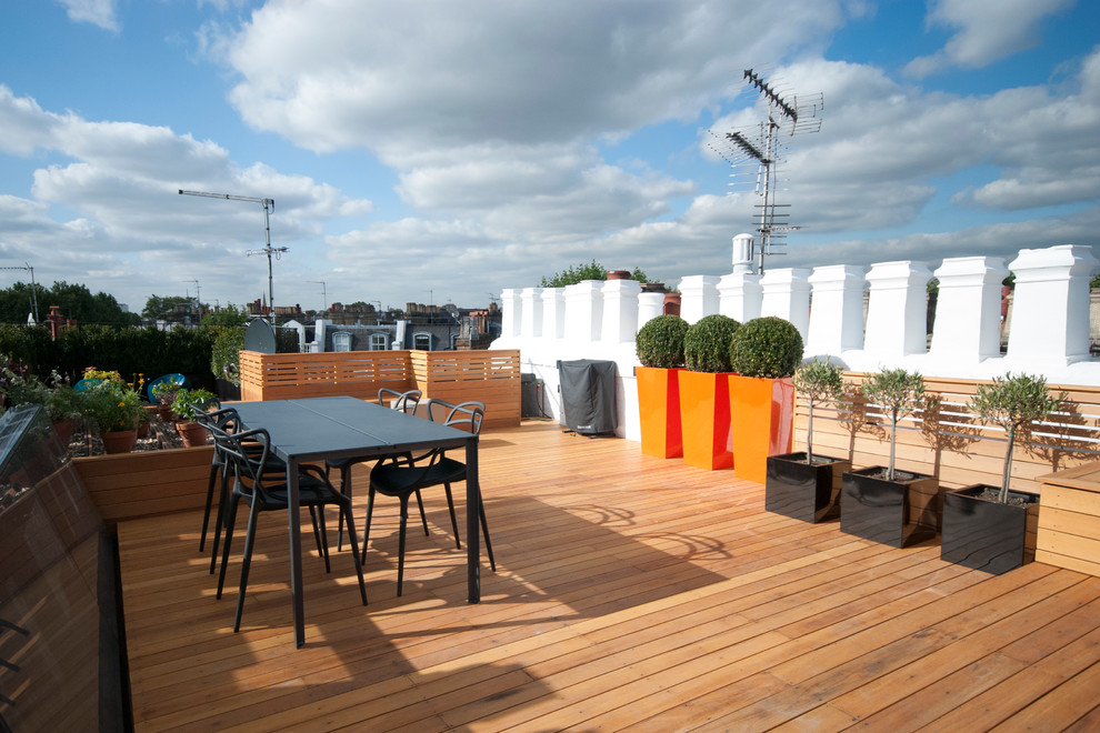 Deck container garden - huge contemporary rooftop deck container garden idea in London with no cover