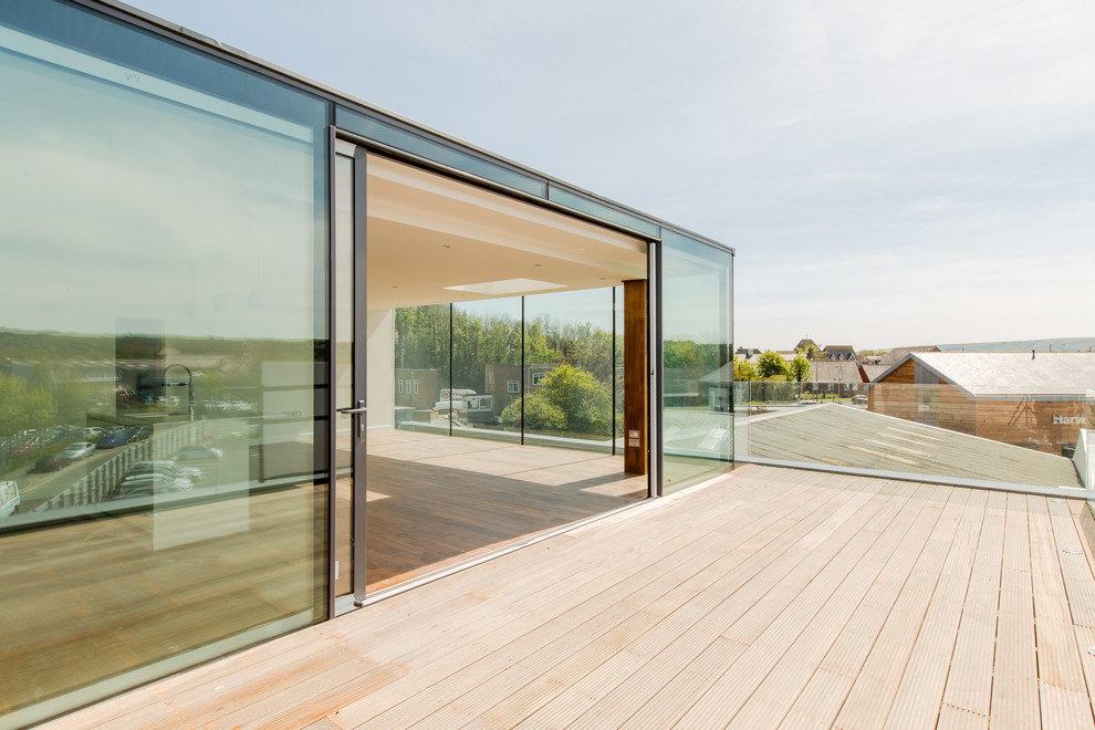 Large industrial roof terrace in Sussex with a roof extension.