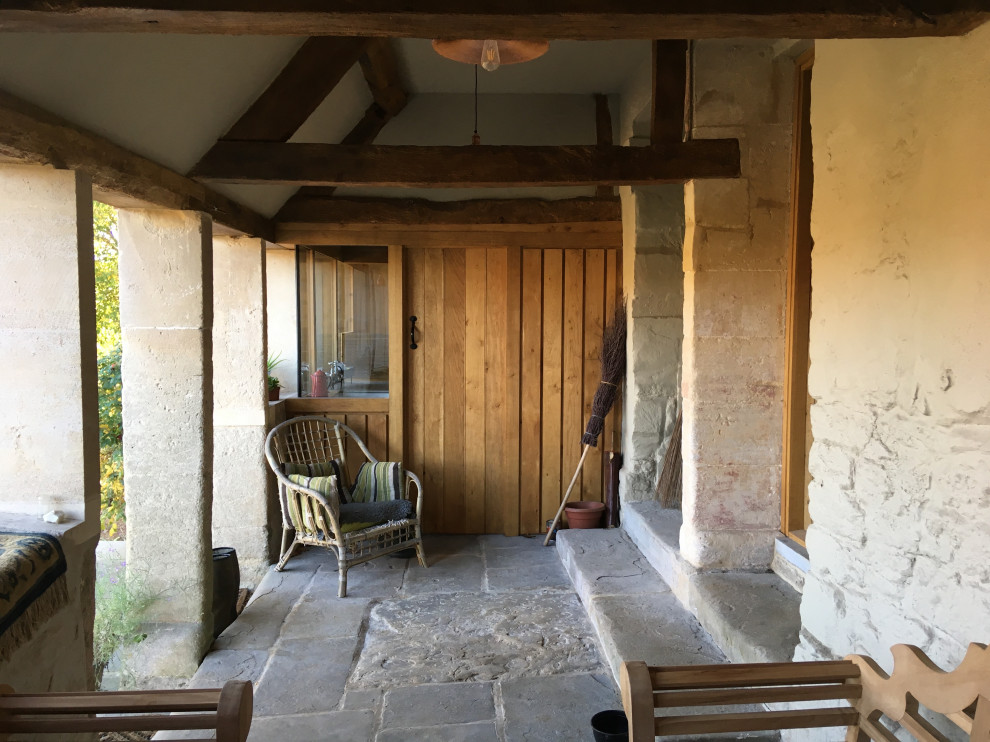 Country courtyard terrace in Wiltshire with a roof extension.