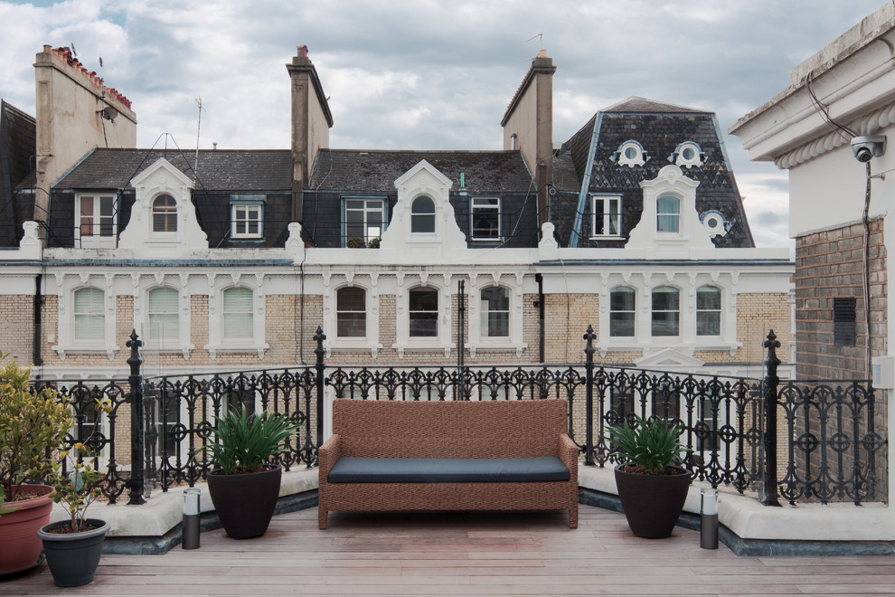 Design ideas for a medium sized contemporary roof rooftop terrace in London with a potted garden and no cover.