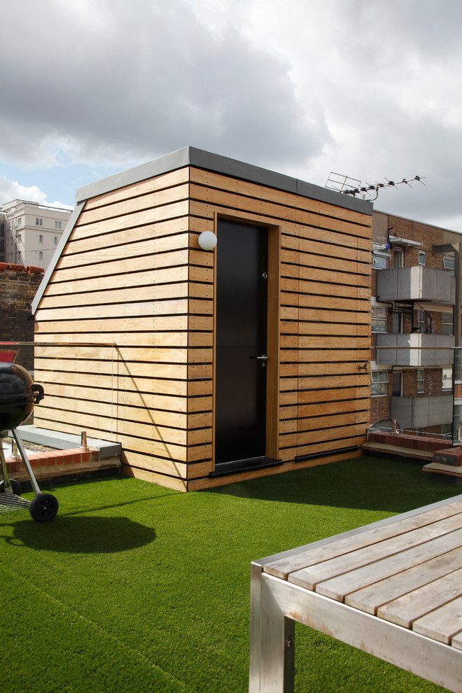 Ispirazione per una grande privacy sulla terrazza design sul tetto con nessuna copertura