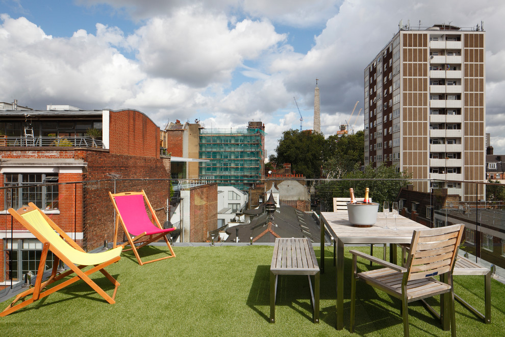 Photo of a large contemporary roof rooftop terrace in London with no cover.