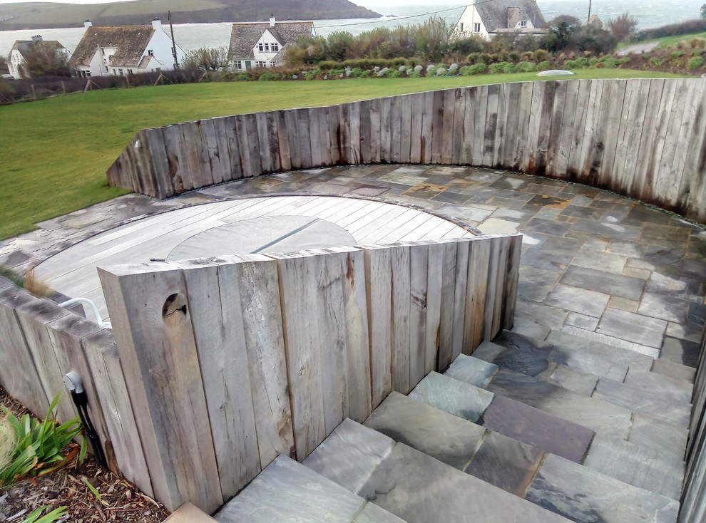 Deck - mid-sized scandinavian backyard deck idea in Cornwall