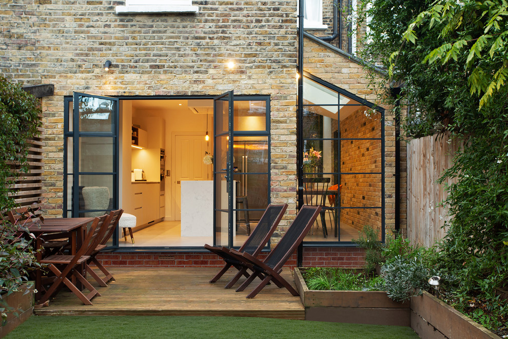 Photo of a contemporary back terrace in London with no cover.