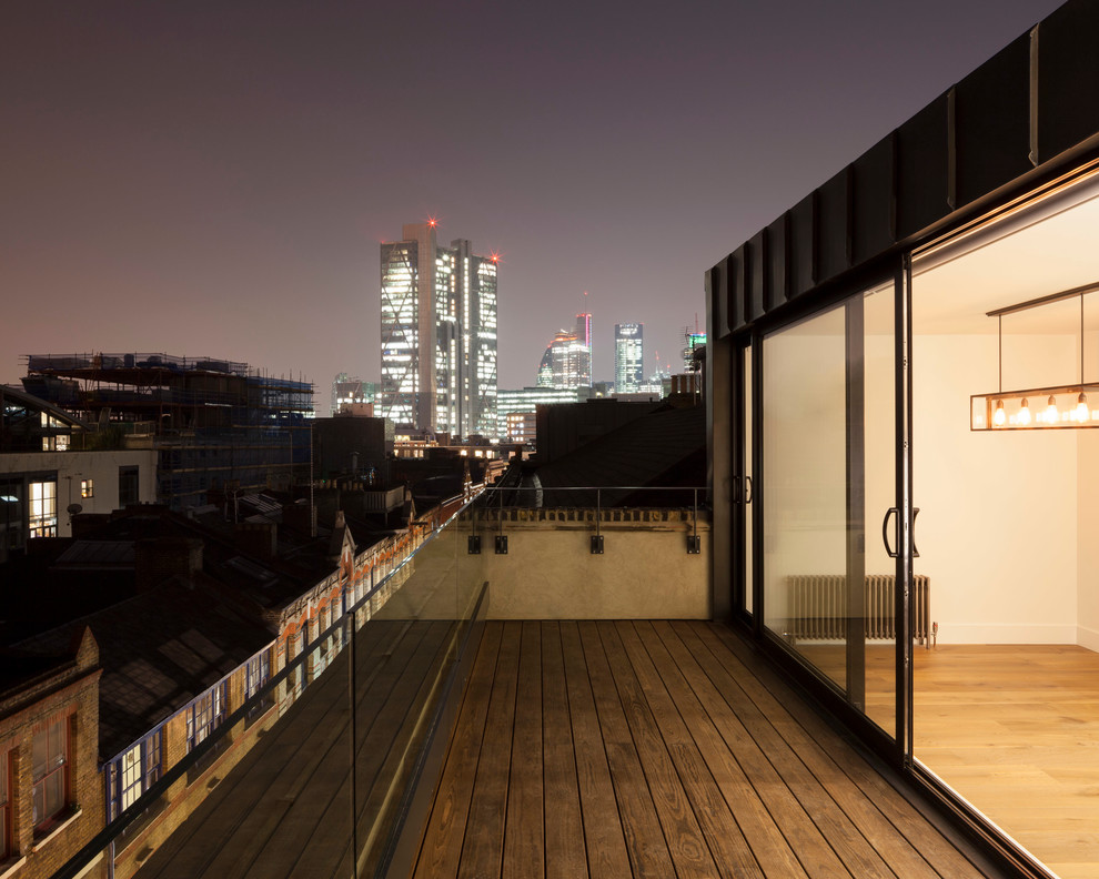 Photo of a medium sized contemporary roof terrace in London with no cover.