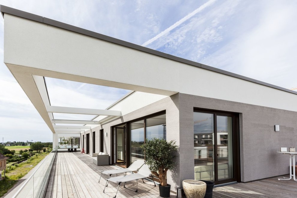 Idées déco pour une terrasse sur le toit contemporaine avec un auvent.