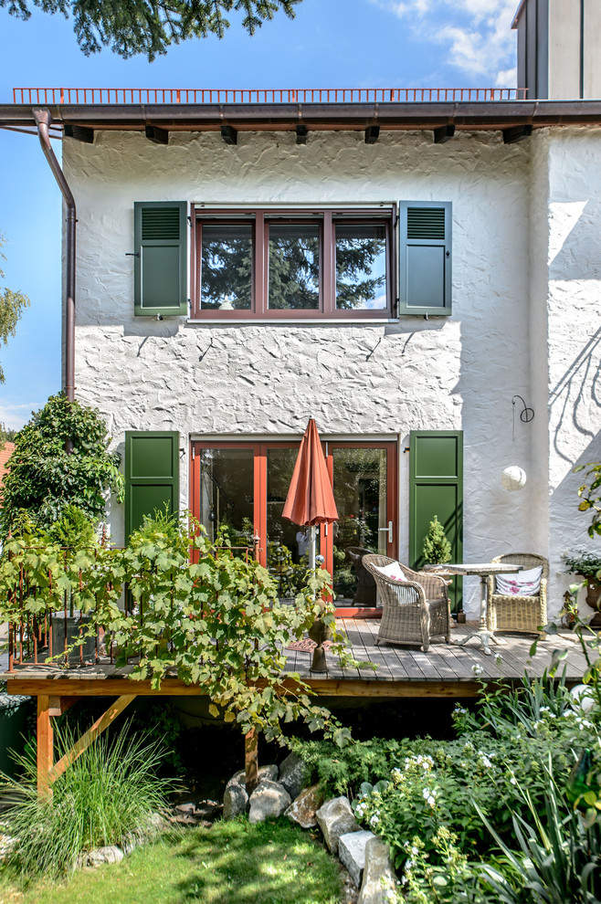 This is an example of a large mediterranean back terrace in Munich with no cover.