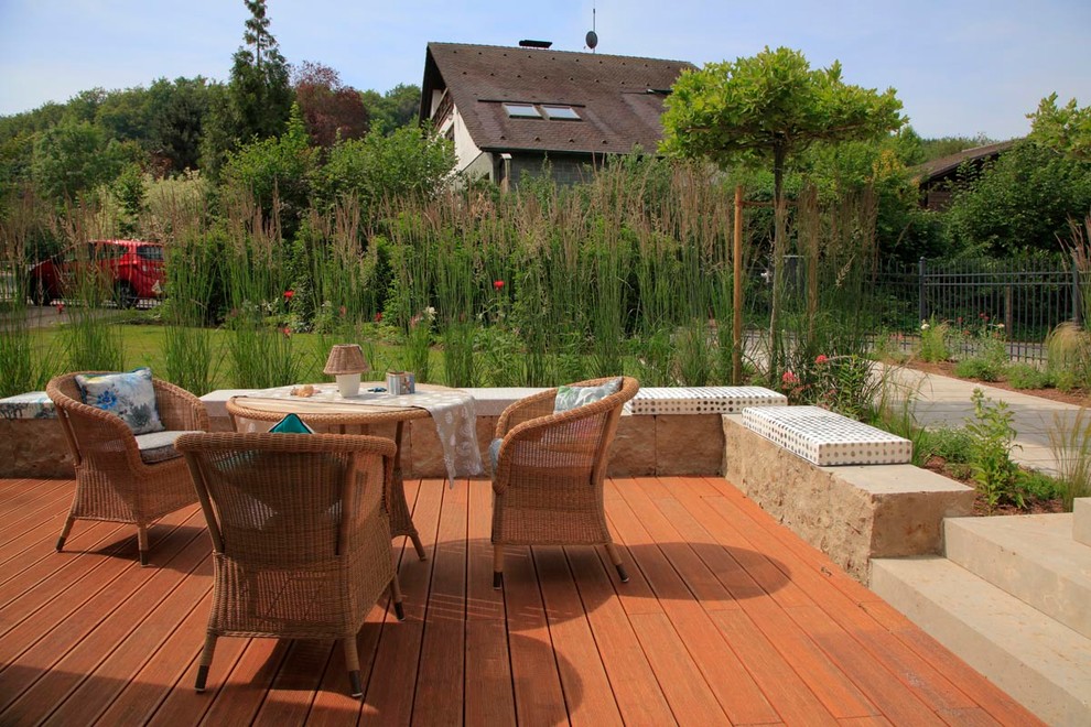 Photo of a large contemporary back terrace in Frankfurt with a water feature and no cover.
