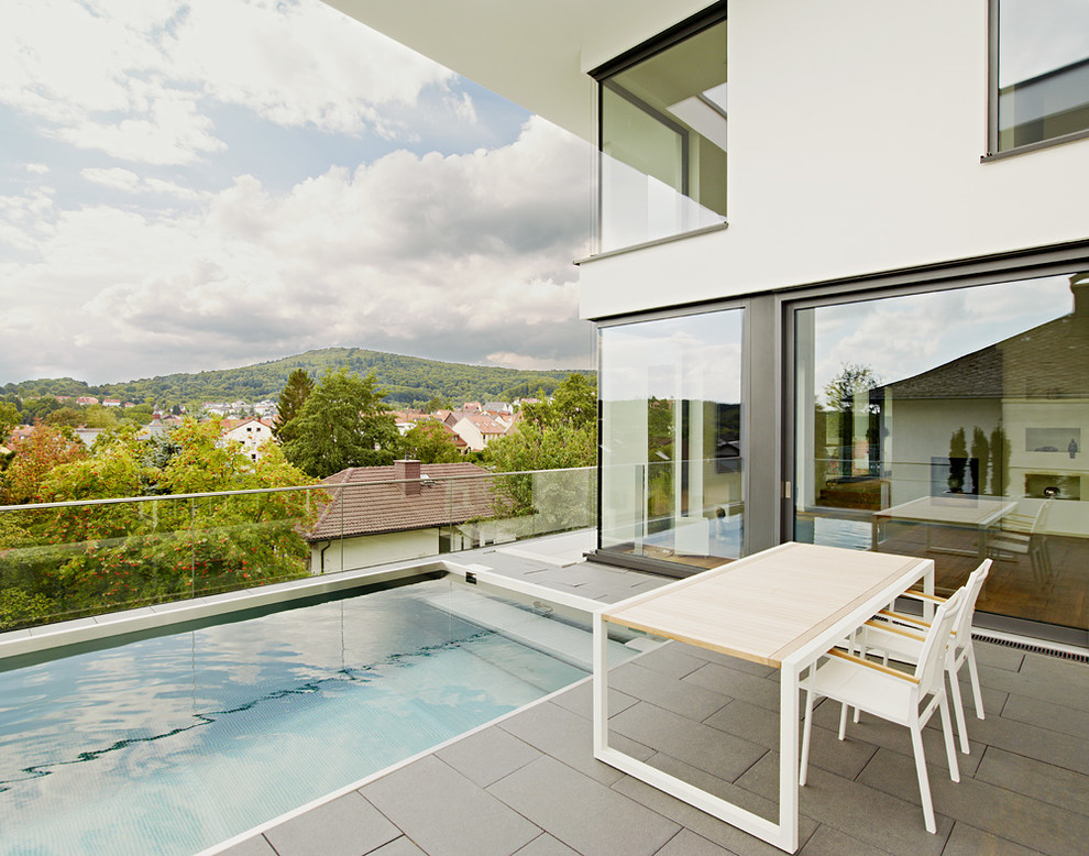 Deck - large contemporary rooftop rooftop deck idea in Stuttgart with no cover