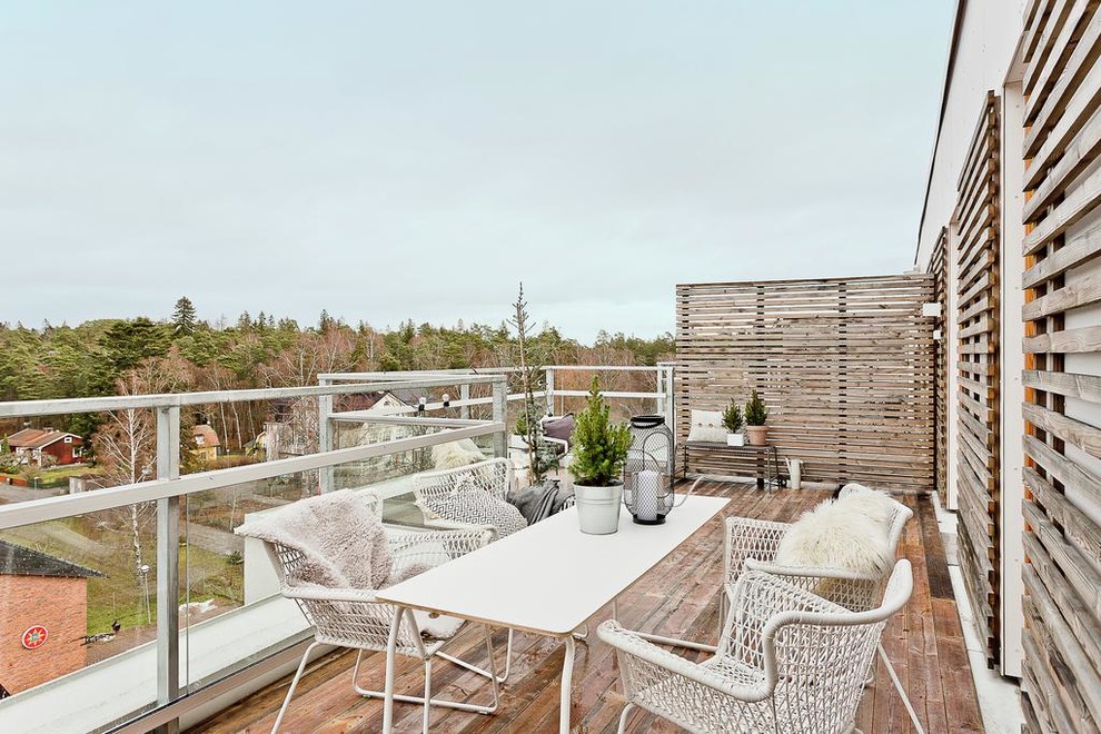 Photo of a scandinavian roof rooftop terrace in Stockholm with no cover.