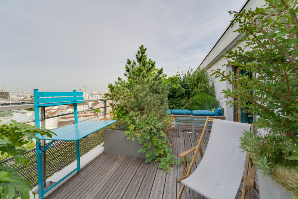 Exemple d'une terrasse avec des plantes en pots éclectique avec aucune couverture.