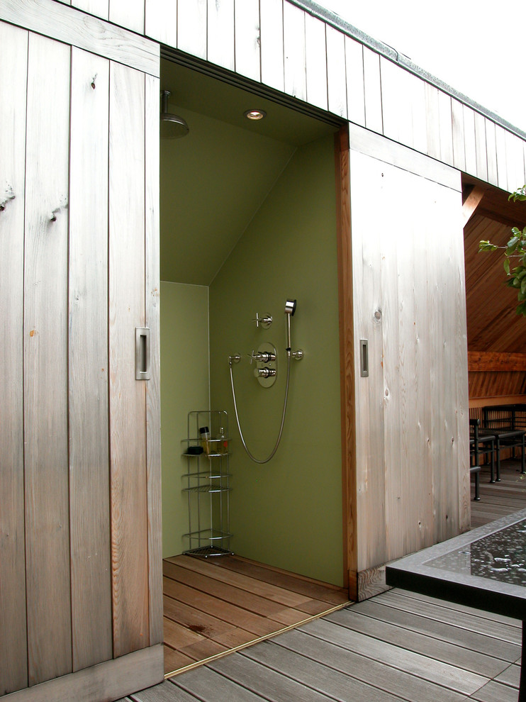 Trendy outdoor shower deck photo in Paris with no cover