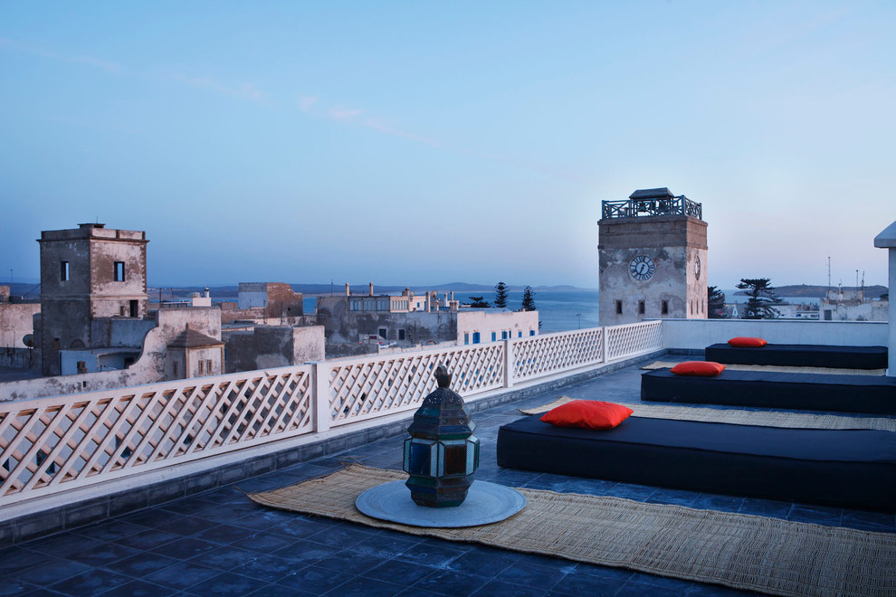 Inspiration for a large mediterranean roof rooftop terrace in Paris with no cover.