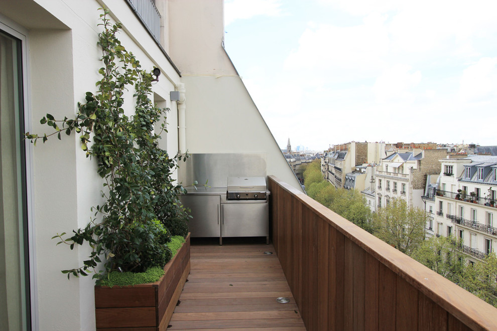 Aménagement d'une terrasse contemporaine avec une cuisine d'été.