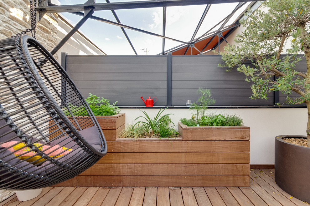 Exemple d'une terrasse tendance avec une cuisine d'été, une cour et une extension de toiture.