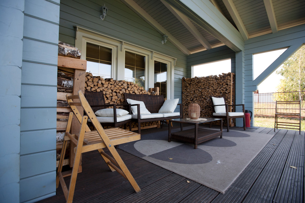 Источник вдохновения для домашнего уюта: терраса среднего размера на заднем дворе в скандинавском стиле с навесом