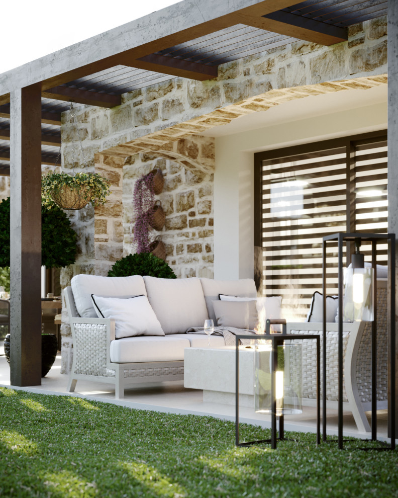 Modelo de terraza mediterránea de tamaño medio en patio trasero y anexo de casas con cocina exterior