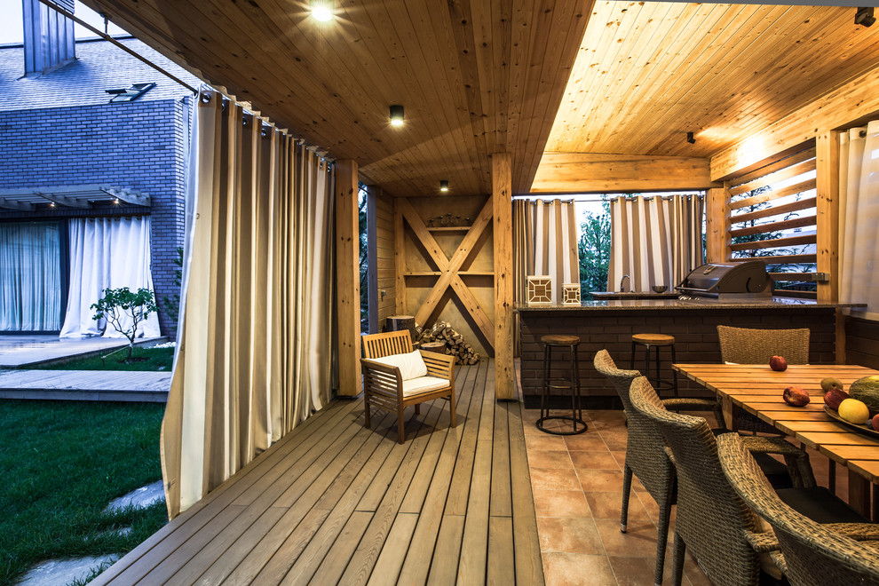 This is an example of a scandi terrace in Moscow with an outdoor kitchen.