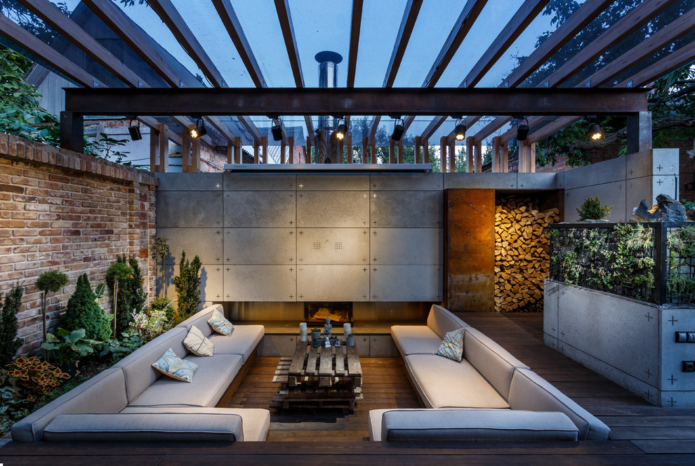 Inspiration for a contemporary backyard deck remodel in Other with a pergola
