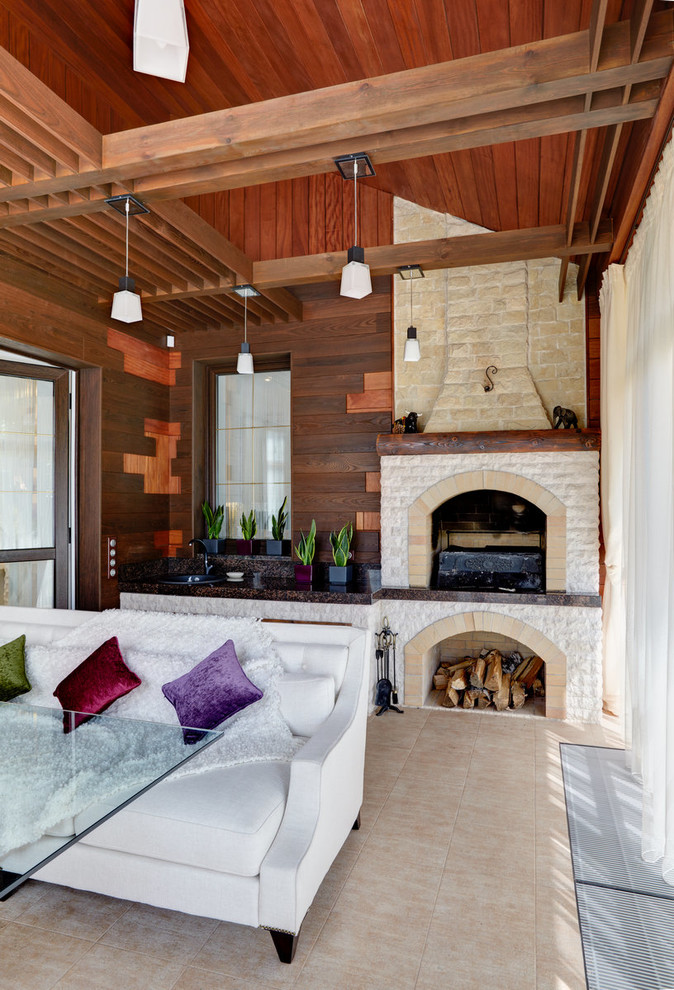 Inspiration for a transitional sunroom remodel in Moscow with a standard fireplace, a stone fireplace and a standard ceiling