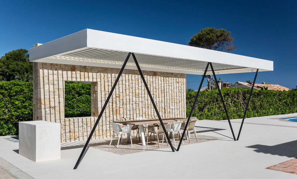 Foto de terraza mediterránea en anexo de casas con losas de hormigón