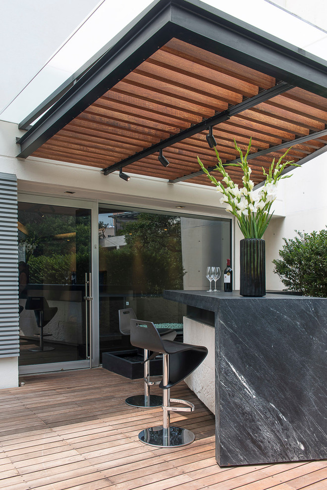 Design ideas for a contemporary terrace in Mexico City with a pergola and a bar area.