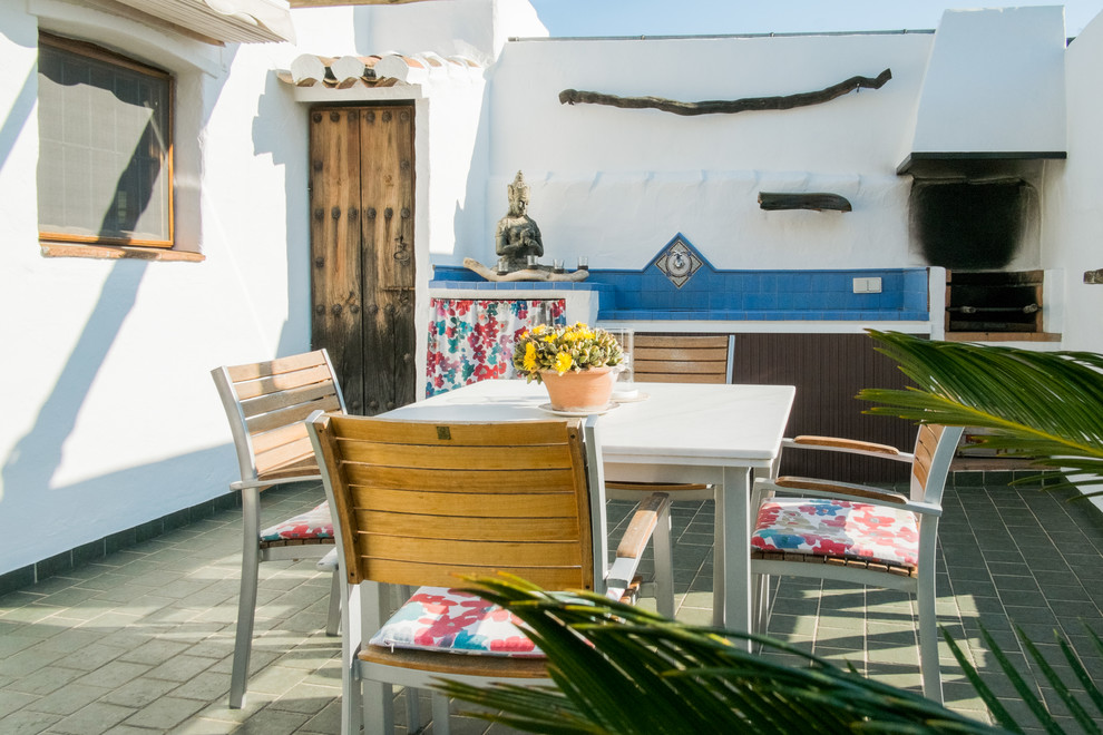 Deck - mid-sized mediterranean rooftop deck idea in Malaga with no cover