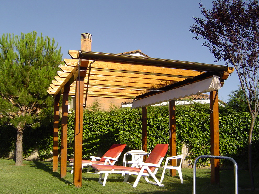 Inspiration for a medium sized contemporary veranda in Madrid with a pergola.