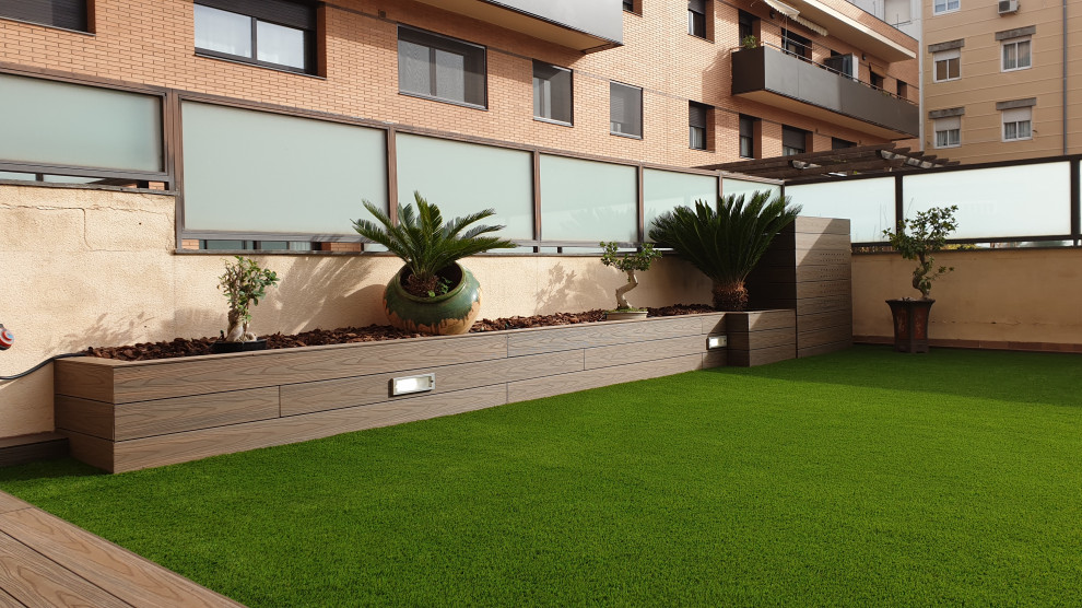 Inspiration for an expansive modern back terrace in Other with a potted garden and no cover.