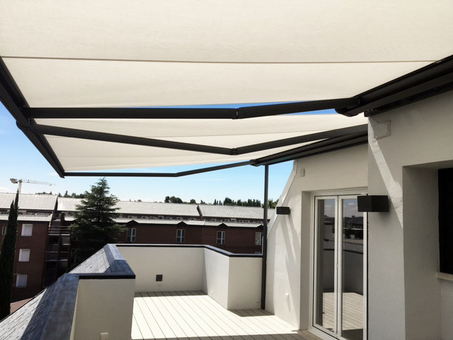 Large scandinavian side terrace in Madrid with an awning.