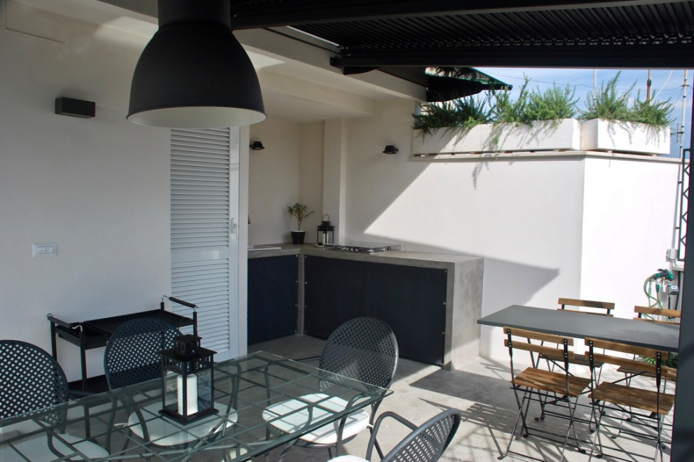 Photo of an expansive scandi roof terrace in Rome with an outdoor kitchen and an awning.
