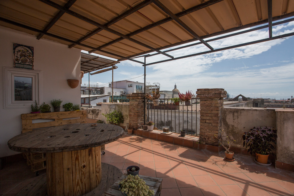 Design ideas for a large scandi roof terrace in Naples with a pergola.