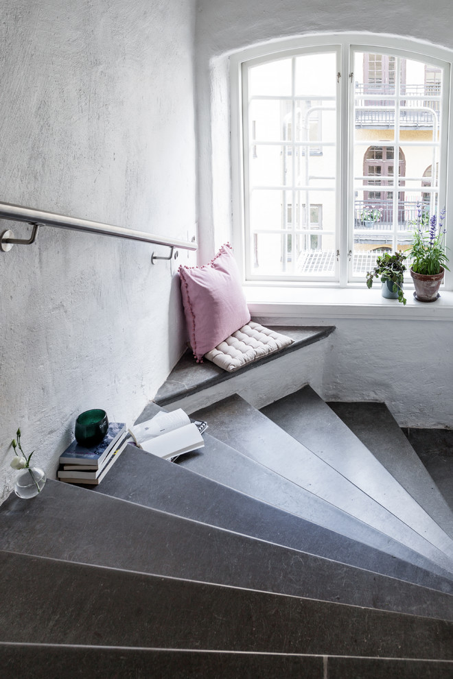 Medium sized scandinavian concrete curved staircase in Stockholm.