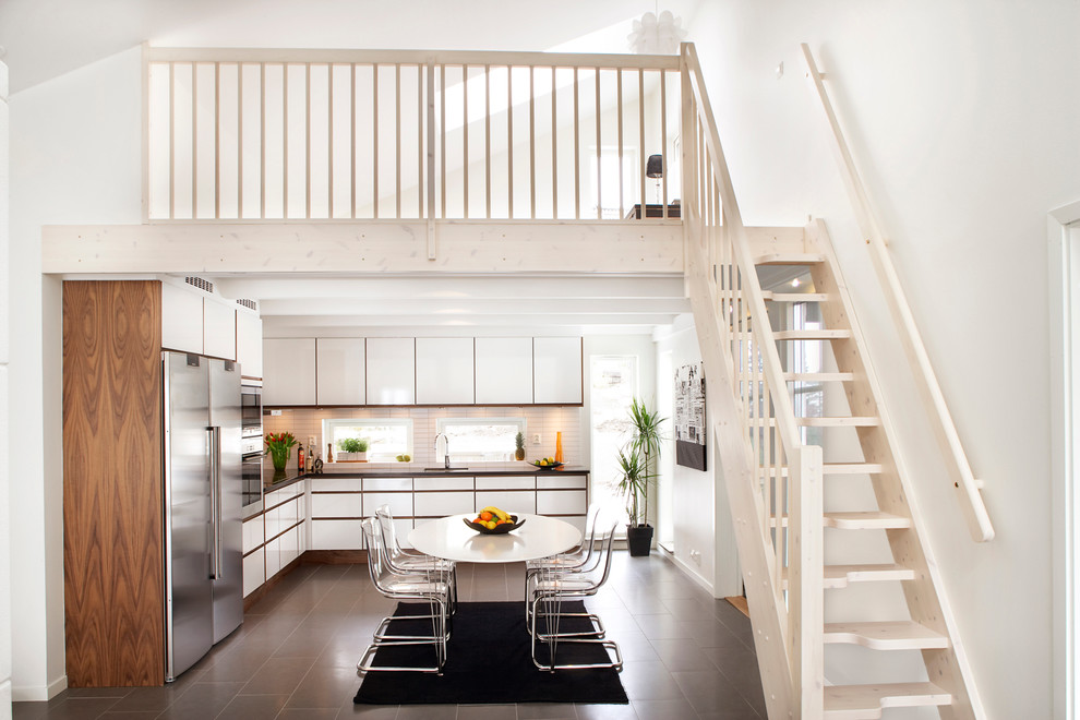 Design ideas for a small scandinavian wood straight staircase in Other with wood risers.