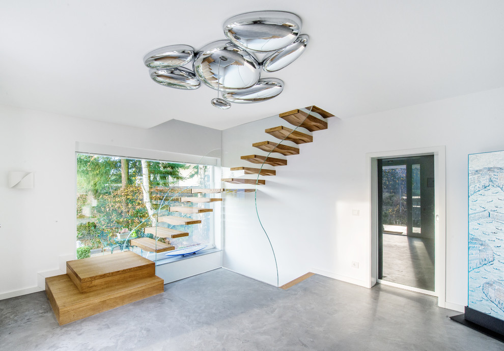 Idées déco pour un escalier contemporain en L de taille moyenne avec des marches en bois.