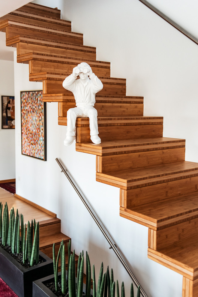 Design ideas for a medium sized contemporary wood straight staircase in Nuremberg with wood risers.