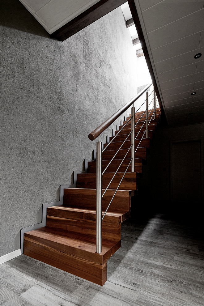 Inspiration for a medium sized contemporary wood straight staircase in Dortmund with wood risers.