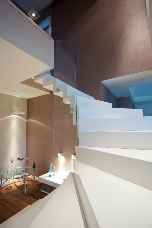 Example of a large trendy concrete floating staircase design in Other with concrete risers