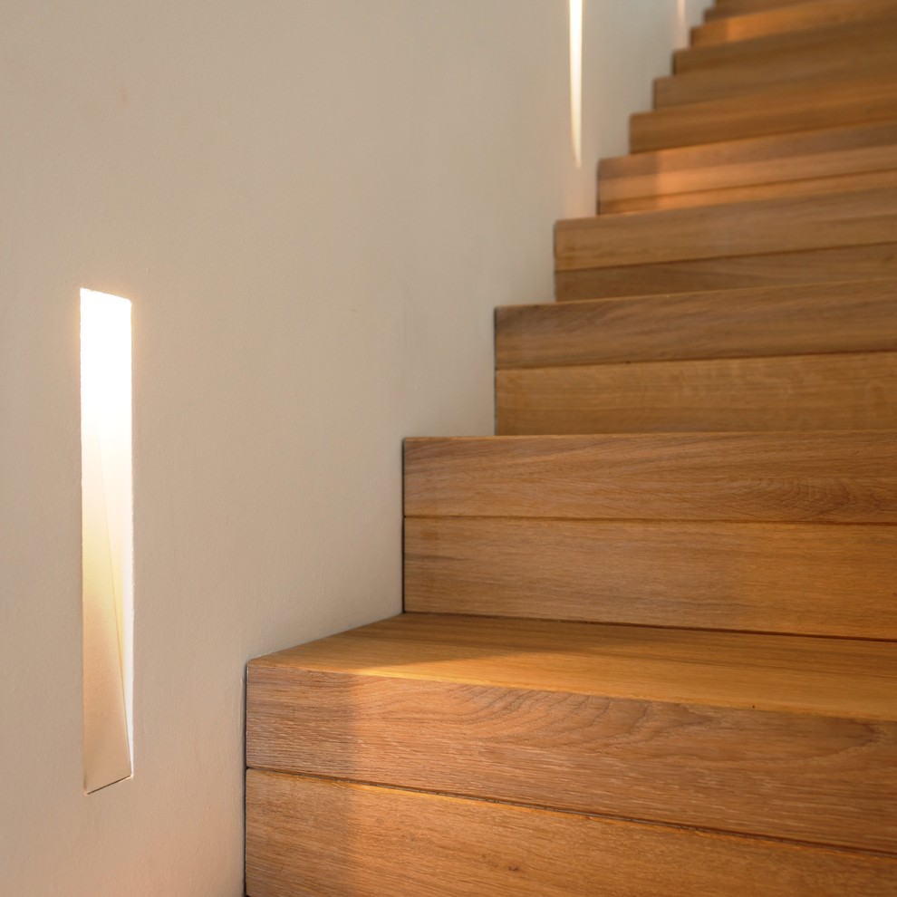 Large trendy wooden straight staircase photo in Other with wooden risers