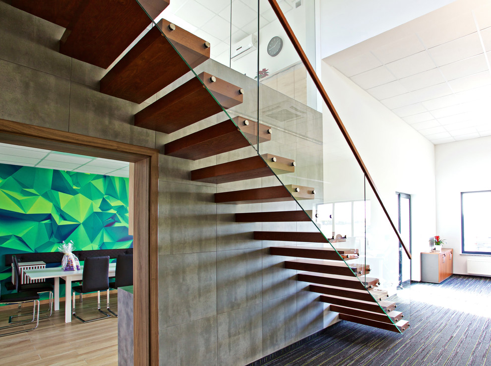 Ejemplo de escalera suspendida moderna grande sin contrahuella con escalones de madera