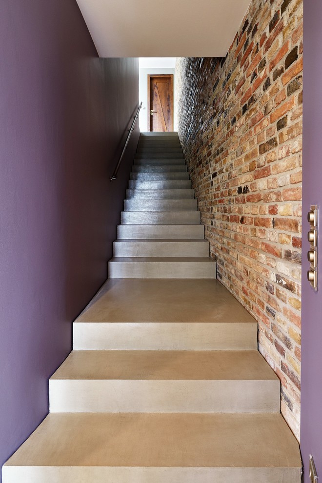 Inspiration pour un escalier bohème en béton avec des contremarches en béton.