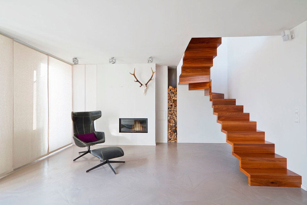Ejemplo de escalera en U contemporánea de tamaño medio con escalones de madera y contrahuellas de madera