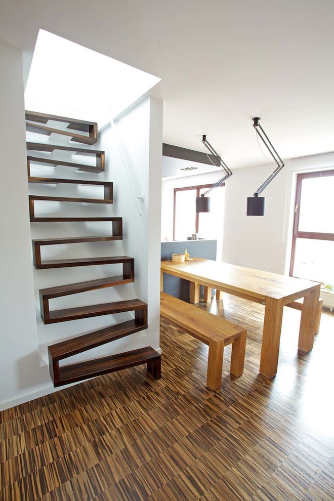 Small contemporary wood straight staircase in Other with open risers.