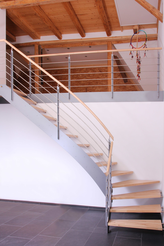 Пример оригинального дизайна: угловая лестница среднего размера в современном стиле с деревянными ступенями