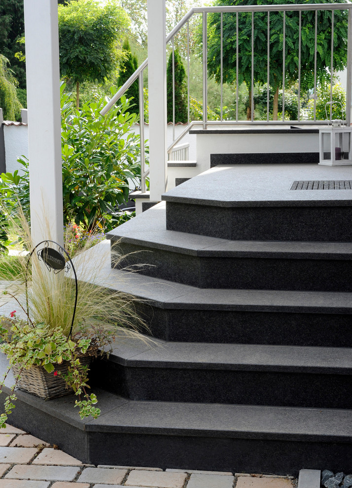 Inspiration for a small contemporary straight metal railing staircase remodel