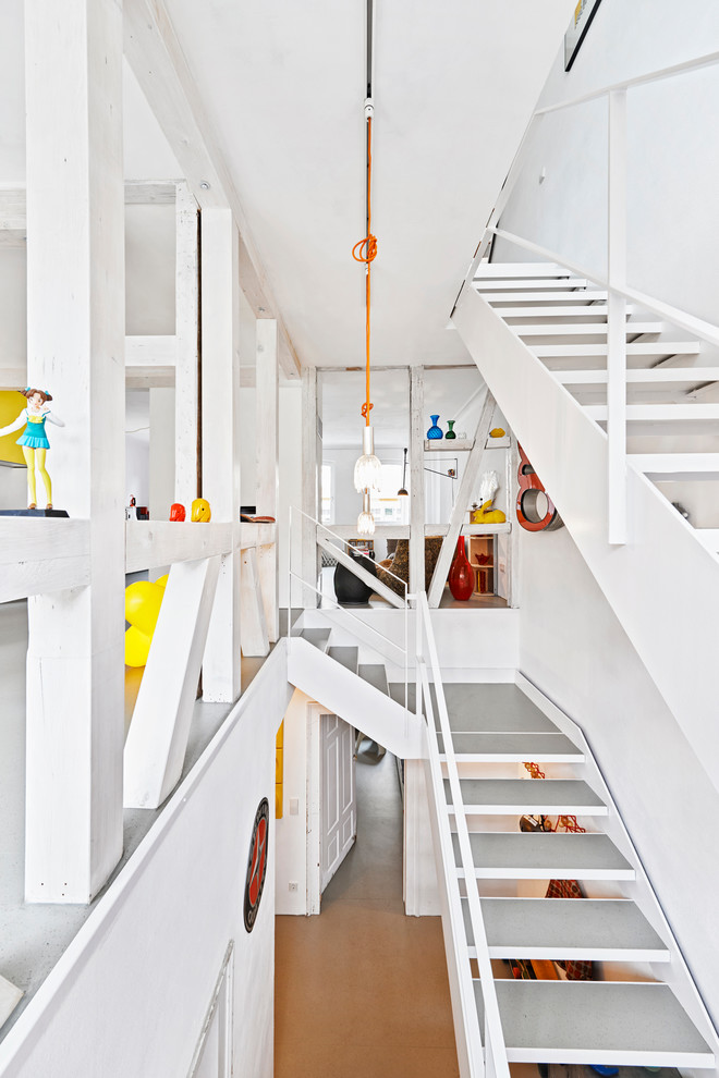 Inspiration for a large eclectic concrete l-shaped open staircase remodel in Stuttgart